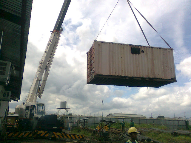 mobile crane lifting the container van