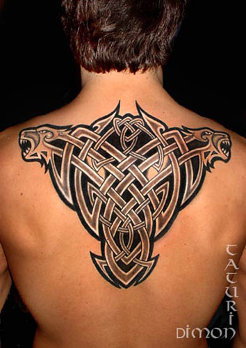 Celtic rib cage tattoo with negative tribal veil 