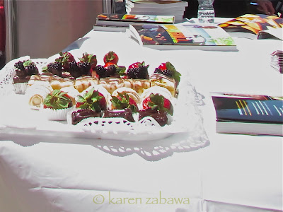 Strawberries dipped in chocolate, brownies and protiferoles dessert at bbq.