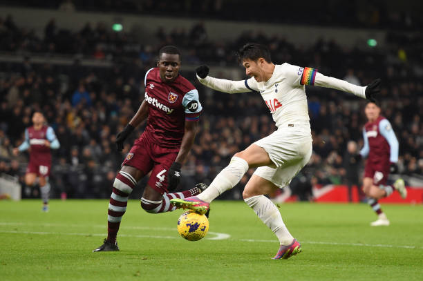 Son Heung-Min of Tottenham Hotspur is challenged by Kurt Zouma of West Ham United during the Premier League match between Tottenham Hotspur and West Ham United at Tottenham Hotspur Stadium on December 07, 2023 in London, England.