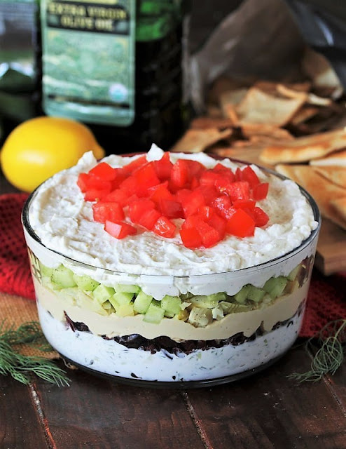 Adding Last Layer of 7-Layer Greek Dip Image