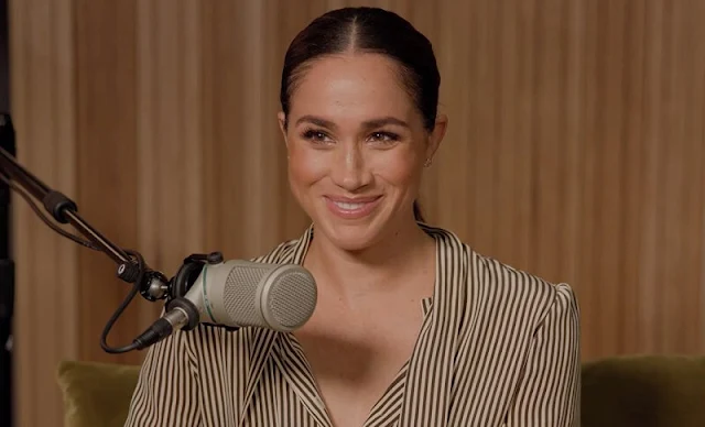 Meghan Markle wore a brown and white stripes silk shirt, with beige cropped pants and nude stiletto heels