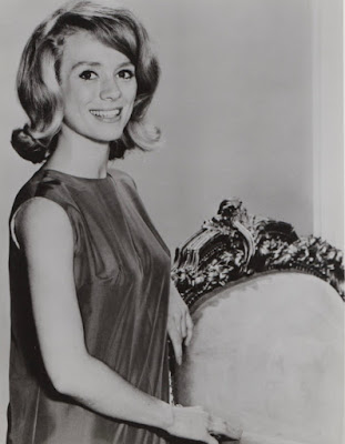 Inger Stevens stands by chair in promotional photo