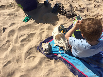 Boy with autims on the beach