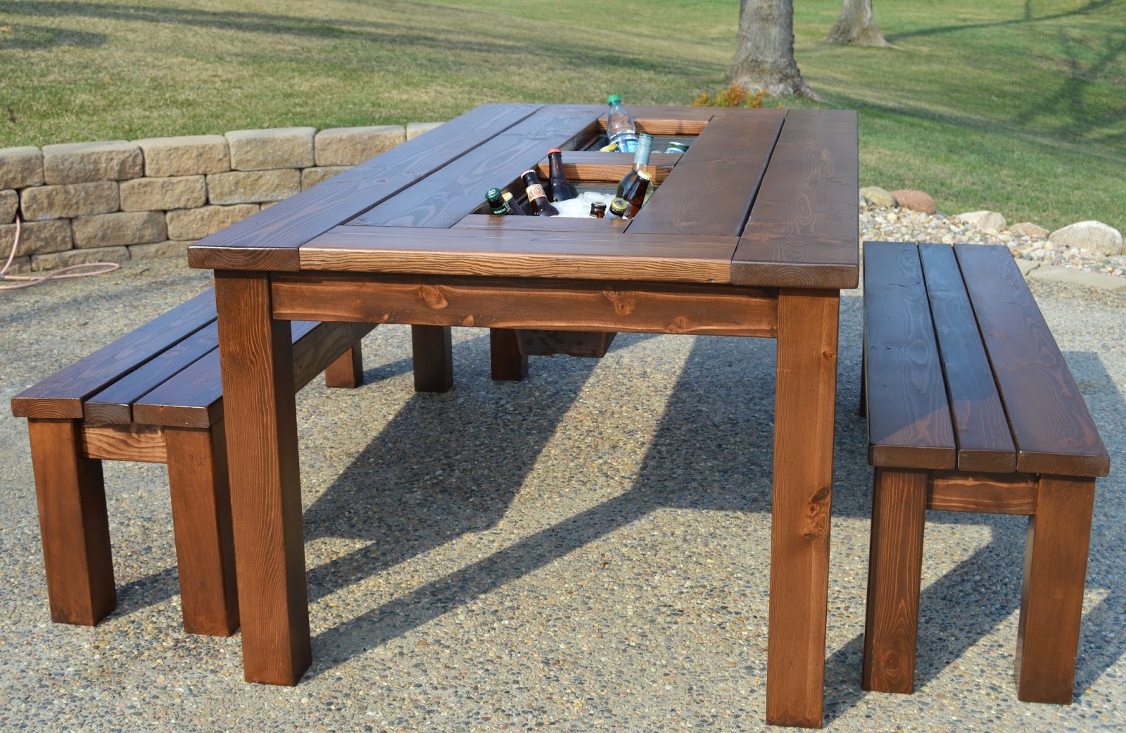 We built this patio table with flower boxes set down inside of them 