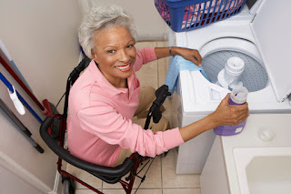 Senior doing laundry