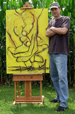 Dennis Ryan standing next to his 3 foot wide by 4 foot high fine art painting titled Mellow Yellow