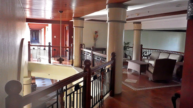 hallway with resting areas at Ormoc Villa Hotel