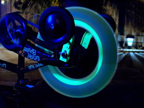 glowing art created by consistently spinning tires that have glow sticks on them