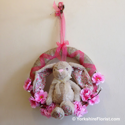 Handmade jute wreath with cherry blossoms and rabbit