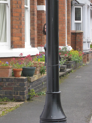 Lola II hiding behind a lamp post, she's that thin!