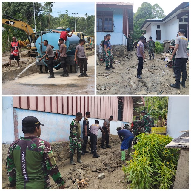 Personel Polres Teluk Wondama Bersama TNI dan Instansi Terkait Serta Warga Bersihkan Sampah dan Debu di Ruas Jalan Pasca Banjir