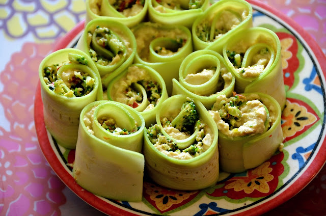 Raw zucchini Rolls with cashew cheese and broccoli sun-dried tomato pesto