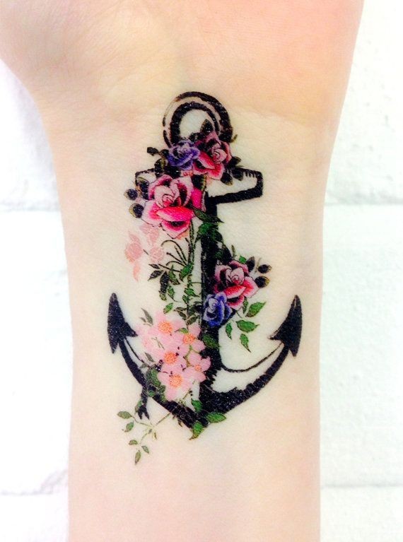 Amasing black anchor with flowers tattoo on wrist