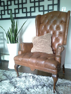 Tufted leather wing back chair 