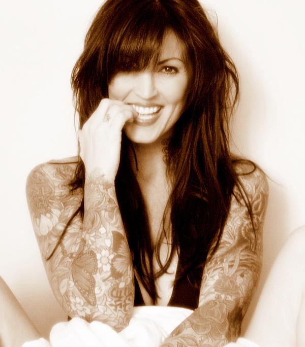 beautiful woman with Japanese sleeve tattoos back tattoo lotus flowers