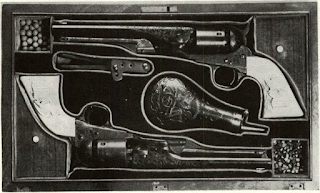 Cases for Colts varied. Top set of Wartime Navy 36’s is enigmatically marked “Division AideDe-Camp.” Original owner is unknown (from Jonathan Peck colln). Center is set of New Model Navys belonging to Gen. Phil Sheridan. Both this set and Navy 51’s above have proper Navy Colt flask with set. Eagle handles are carved with names of battles in which Sheridan fought: Booneville, Chaplin Hills,