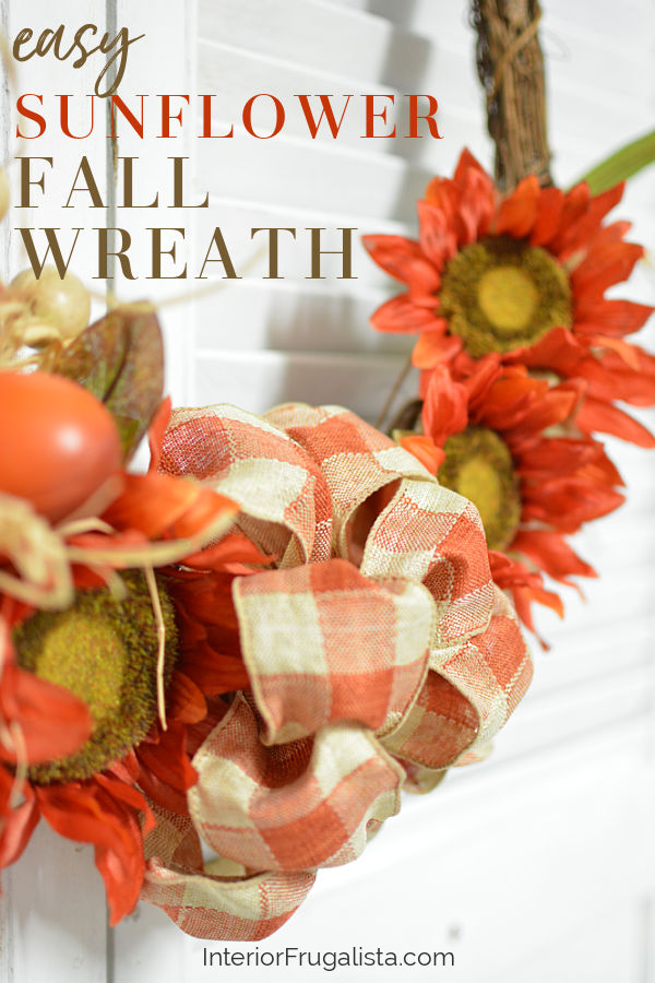 An easy orange sunflower fall wreath DIY idea in bright traditional autumn colors and a recycled grapevine wreath, a budget-friendly fall door wreath. #falldoorwreath #sunflowerwreath