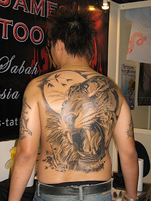 I prefer the black and darker colors for tiger tattoos as it brings out 