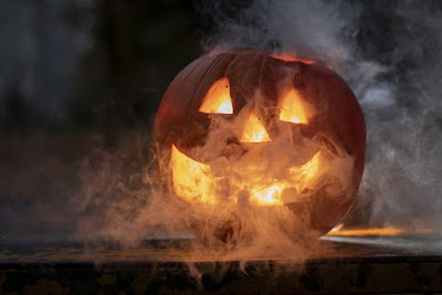 A jack-o-lantern enshrouded in fog.