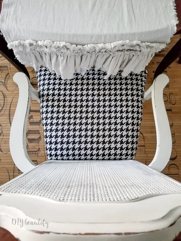 white chair with houndstooth pattern seat cushion