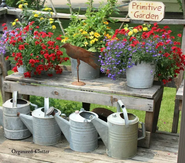 Photo of a junky garden planter vignette.