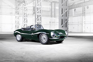 A picture of a green Jaguar open top sports car