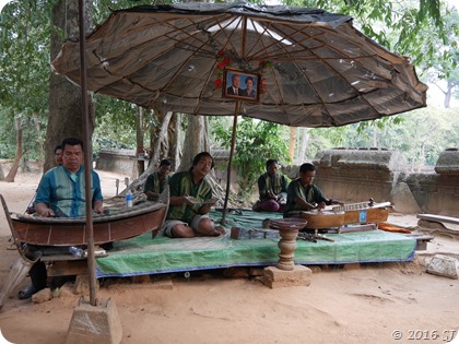 Men singing and playing instruments at Banteay Srei