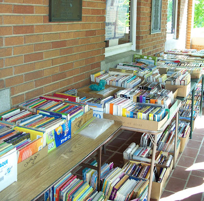 book sale on porch of library