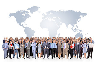 A huge crowd of business people standing before a map of the world