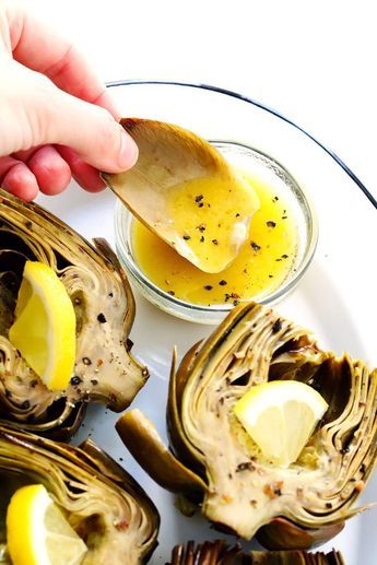 Seriously the most amazing roasted artichokes recipe! They're stuffed with lots of garlic and herbs, seasoned with lots of lemon and black pepper, and roasted to crispy, tender perfection. The perfect vegetable side dish! | Gimme Some Oven #artichokes #roasted #sidedish #vegetable #glutenfree #vegan