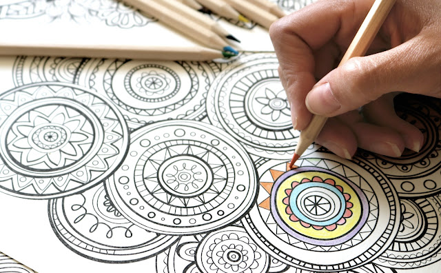 Coloring in an adult coloring book