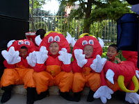 Some of the young performers, dressed as Nintendo-esque cows, waiting