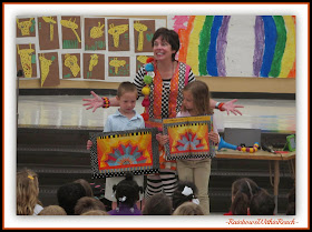 Illustrator Debbie Clement helps Kindergartners compare her original quilt to the finished book's format