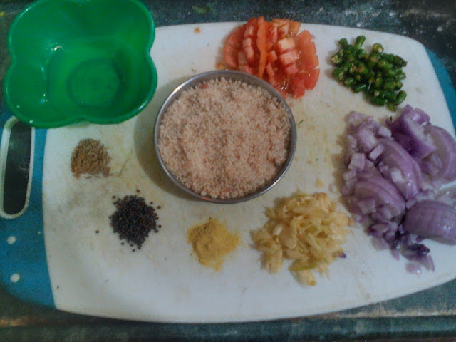A cooking pan displaying shepu bhaji, with an assortment of fresh greens and other ingredients, invitingly arranged.