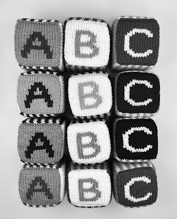 grayscale version of hand knit abc 123 foam blocks in green, blue, purple, pink and white