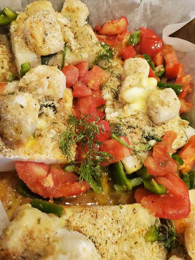 Sea Bass baked with vegetables and scallops