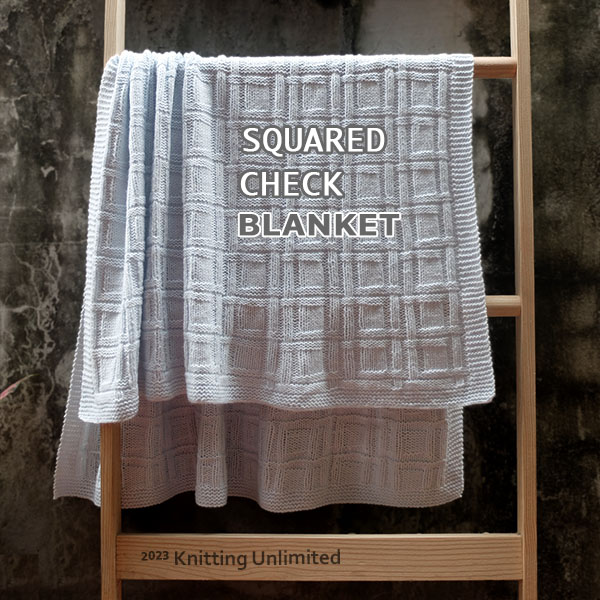 Knitting Unlimited Blanket 43: Squared Check blanket. Size 32”x 44”.