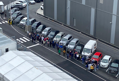line of people waiting for free shuttle to Reykjavik, Iceland