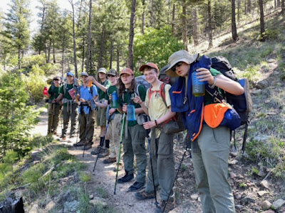 Scouts toast their dads from the trail as they observed Father's Day.