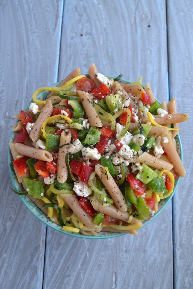 Greek Pasta Salad with Spiralized Noodles makes the perfect lunch or side dish with spiralized zucchini and summer squash, bell peppers, tomato, feta and a homemade vinaigrette. www.nutritionistreviews.com
