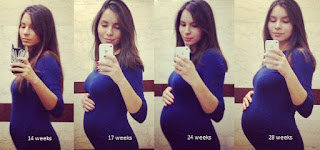 беременная девушка фотографируется в зеркале