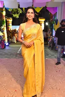 Meenakshi Chaudhary Stuns in Yellow Saree at Sankranthiki Event