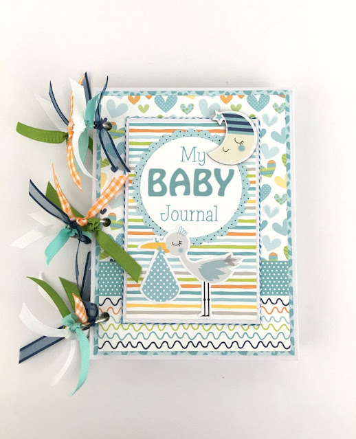 Baby Boy Scrapbook Journal Album with a stork, a moon, and hearts