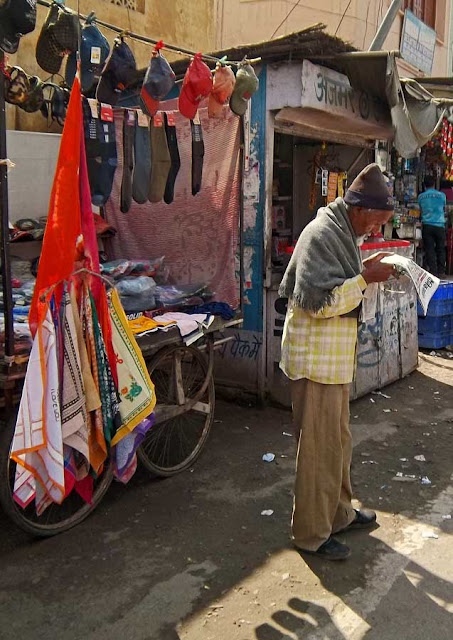 old vendor reading newspaper