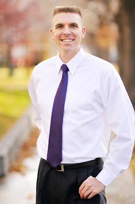 Timothy McGaffin II - Flat Top haircut, smiling, hand in pocket, torso