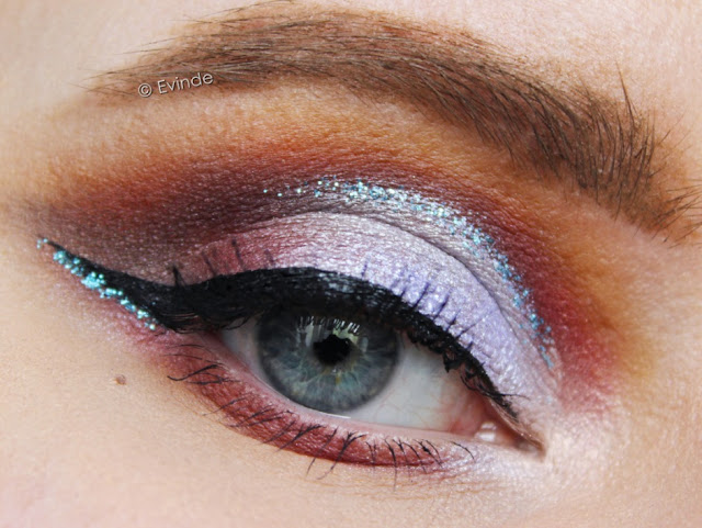 blue and purple cut crease on round eyes