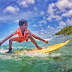 A young but talented surfer in Maldives