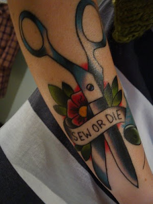 There's a sewing-themed tattoo Flickr group. Sew or Die belongs to Katy.