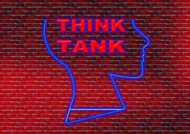 think tank graphic on brick wall